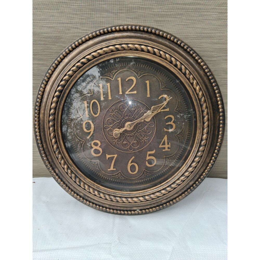 Large ornate bronze wall clock